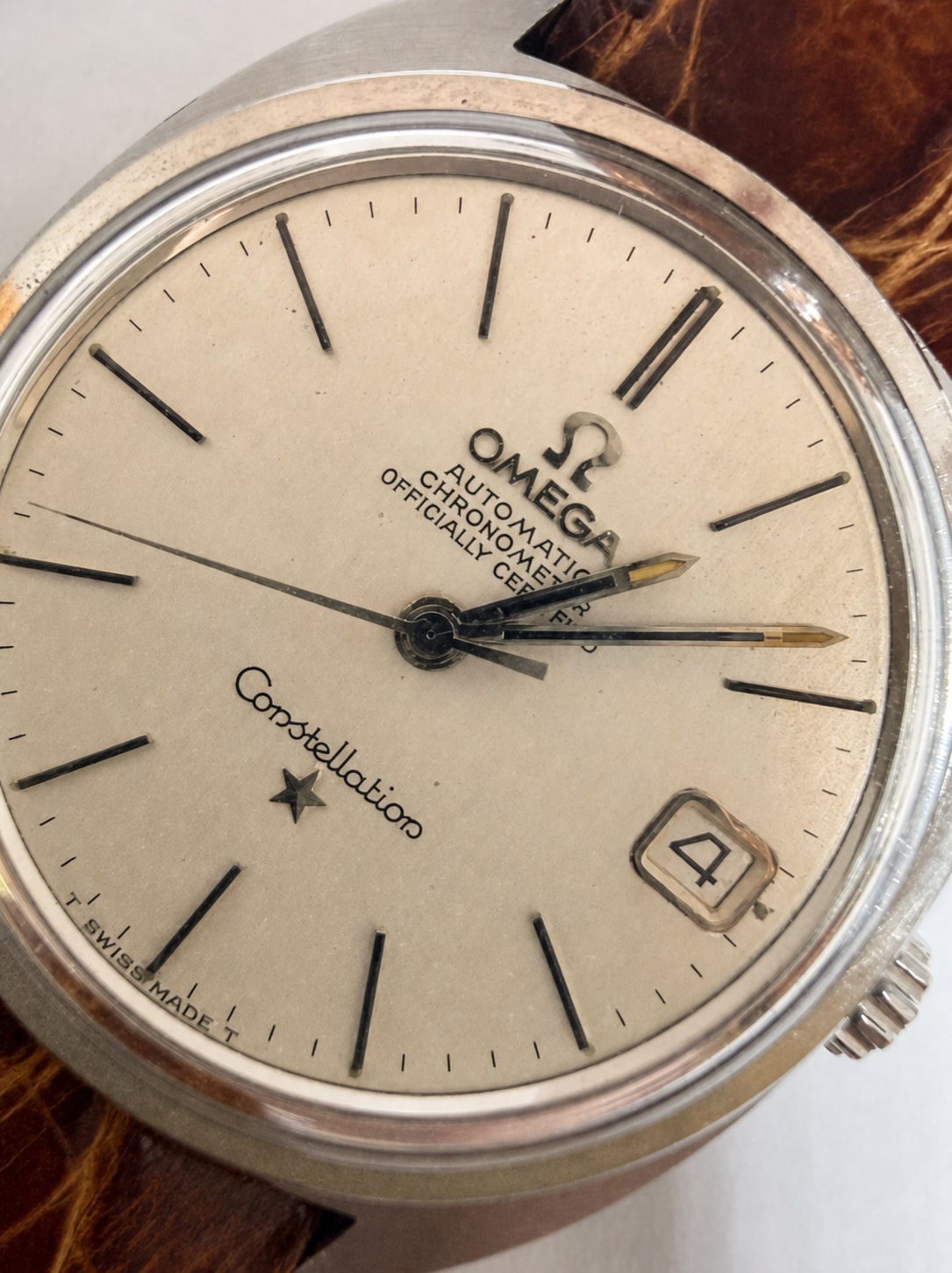 Close detail of a vintage Omega Constellation dial